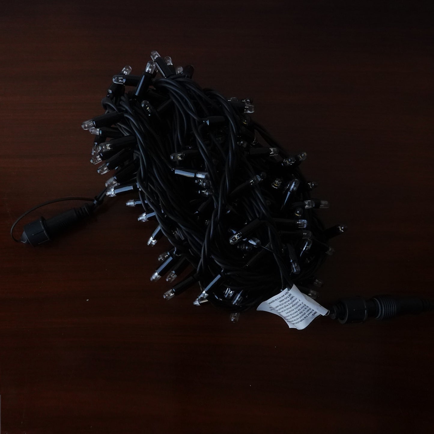 230V 8m micro light strings, warm white 3000K LEDs, with cold white 7000K flash, black cable