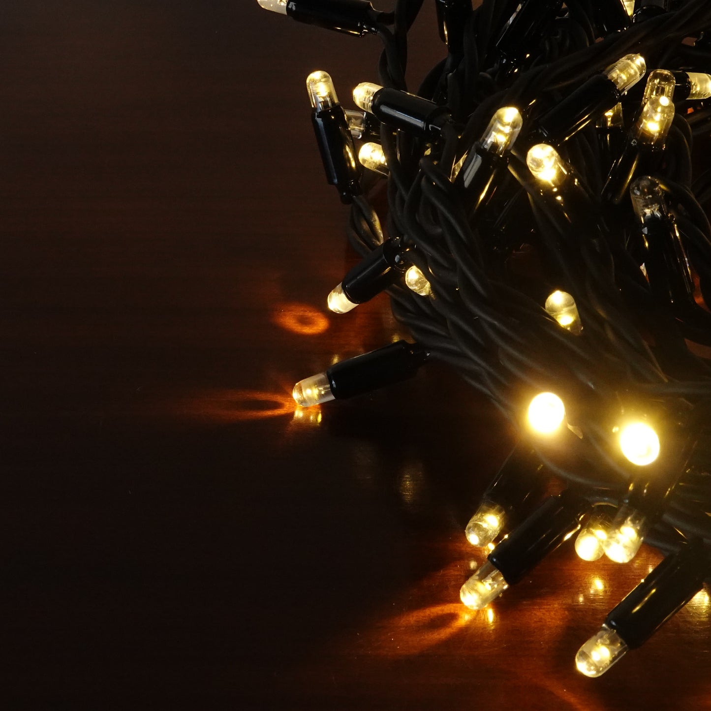 230V 8m micro light strings, warm white 3000K LEDs, with cold white 7000K flash, black cable