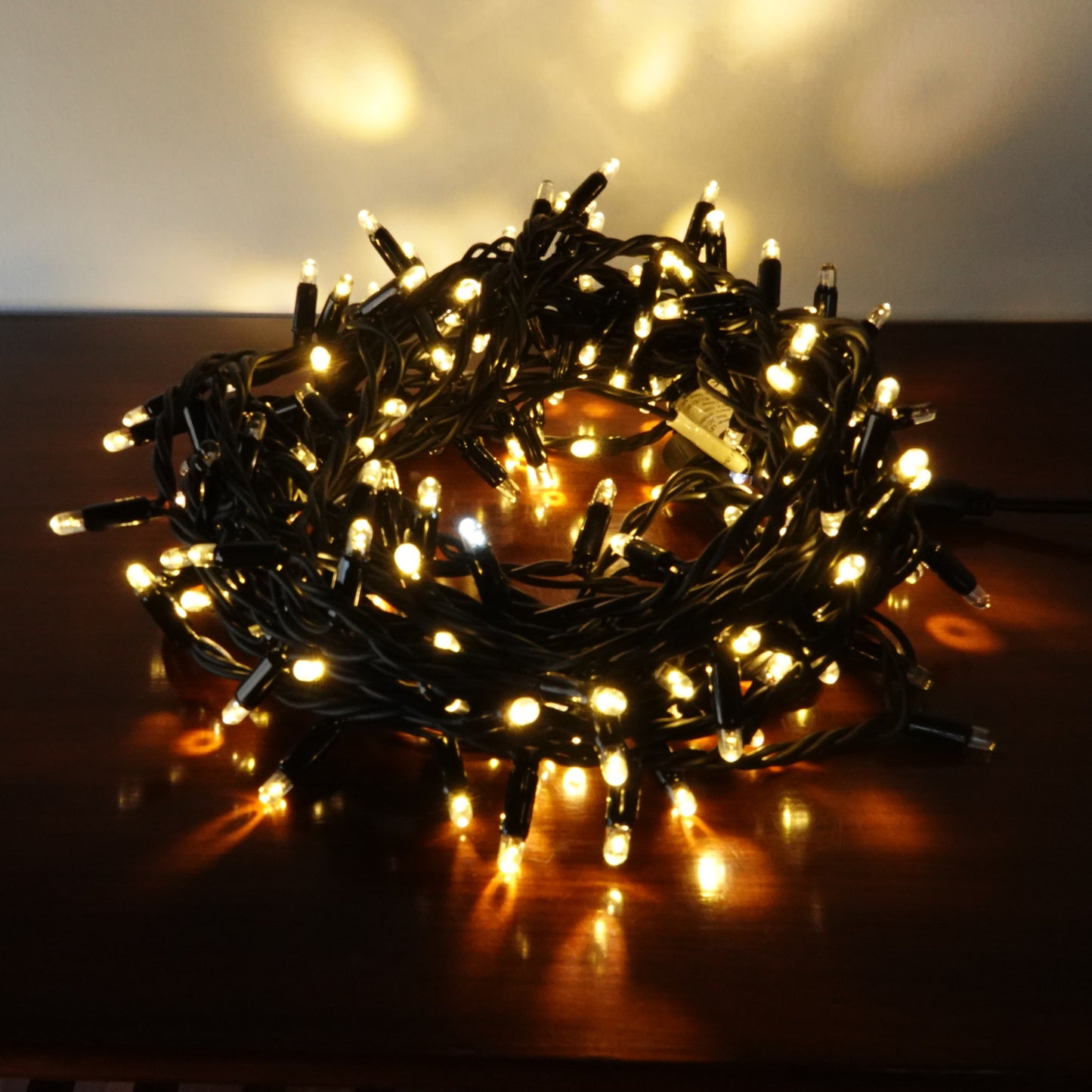 230V 8m micro light strings, warm white 3000K LEDs, with cold white 7000K flash, black cable